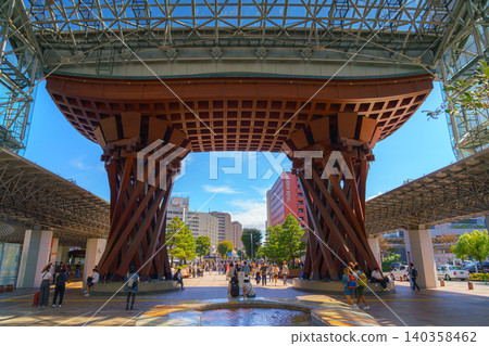 Kanazawa, Japan - Oct 6 2024, A panoramic view of Tsuzumi Gate at the entrance to Kanazawa Station, with people walking in the foreground, at daytime, Kanazawa, Japan Kanazawa, Japan - Oct 6 2024, A panoramic view of Tsuzumi Gate at the entrance to Kanazawa Station, with people walking in the foreground, at daytime, Kanazawa, Japan 140358462