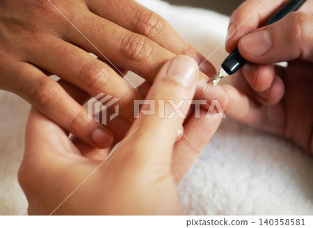 Hands, manicure and cuticle for nails in salon, beauty and treatment to relax. Closeup, spa and tool on fingernail, cleaning and cosmetic service with professional, pamper and luxury for wellness 140358581