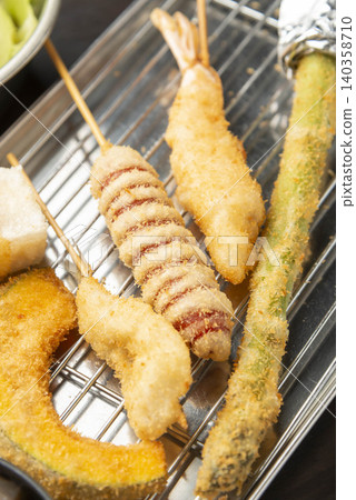 Freshly fried skewers with crispy batter and asparagus skewers Freshly fried skewers with crispy batter and asparagus skewers 140358710