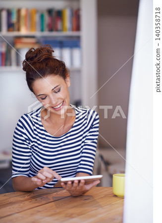 Relax, smile and woman in home office with tablet, search or scroll on social media for business networking. Communication, remote work and girl at table with digital app for freelance, email or post Relax, smile and woman in home office with tablet, search or scroll on social media for business networking. Communication, remote work and girl at table with digital app for freelance, email or post 140358718