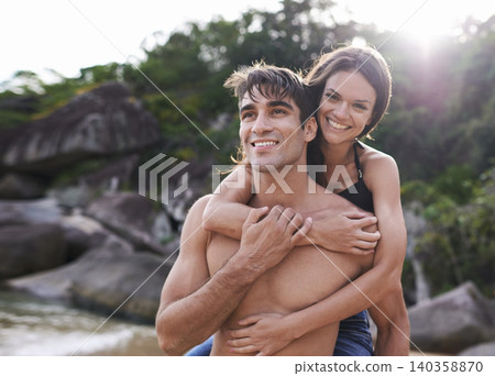 Portrait, piggy back and couple on beach with travel, adventure and relax on summer island holiday. Ocean vacation, woman and man happy in nature on date together with smile, love and romance in Bali Portrait, piggy back and couple on beach with travel, adventure and relax on summer island holiday. Ocean vacation, woman and man happy in nature on date together with smile, love and romance in Bali 140358870