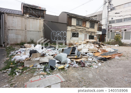 Large piles of illegally dumped waste in vacant lots at the blind spots of the city, where demolished buildings once stood. Large piles of illegally dumped waste in vacant lots at the blind spots of the city, where demolished buildings once stood. 140358906