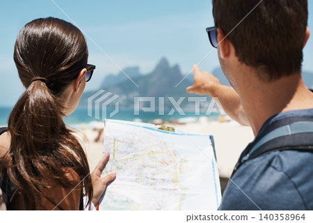 Couple, map and pointing in summer by beach, mountains or smile to check direction for help on vacation. Woman, man and chart at location, landmark or reading with guide on holiday by ocean in Italy Couple, map and pointing in summer by beach, mountains or smile to check direction for help on vacation. Woman, man and chart at location, landmark or reading with guide on holiday by ocean in Italy 140358964