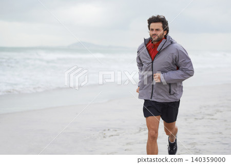 Man, running and exercise at beach for fitness, health and wellness in morning. Athlete person, training and workout in sea with sky, sand and water for sports or motivation or hobby in ocean Man, running and exercise at beach for fitness, health and wellness in morning. Athlete person, training and workout in sea with sky, sand and water for sports or motivation or hobby in ocean 140359000
