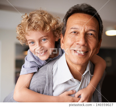 Portrait, senior citizen and boy with smile, piggyback and bonding together in multiracial family. Happy, retired male person or young kid for sweet, hug and embrace with love, cheer and care at home Portrait, senior citizen and boy with smile, piggyback and bonding together in multiracial family. Happy, retired male person or young kid for sweet, hug and embrace with love, cheer and care at home 140359027