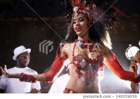 Black woman, samba performance with band at night for carnival season celebration in Rio de janeiro with sequins costumes. Female person, happy and dancing at festival with unique fashion for culture Black woman, samba performance with band at night for carnival season celebration in Rio de janeiro with sequins costumes. Female person, happy and dancing at festival with unique fashion for culture 140359039