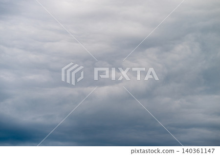 Ominous storm clouds brewing with motion, deep slate tones and heavy texture, swirling formations evoke tension and dynamic weather energy for editorial and alert graphics Ominous storm clouds brewing with motion, deep slate tones and heavy texture, swirling formations evoke tension and dynamic weather energy for editorial and alert graphics 140361147