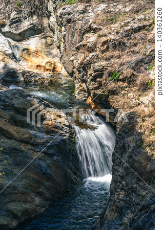Clear stream flowing over rocky terrain d-2 Cool colors Clear stream flowing over rocky terrain d-2 Cool colors 140361260