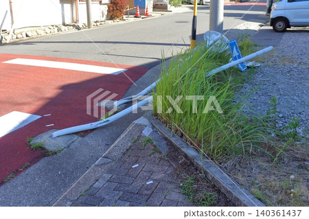 Road sign knocked down in a traffic accident Road sign knocked down in a traffic accident 140361437