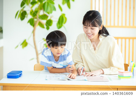 Family: A boy studying with his mom Family: A boy studying with his mom 140361609