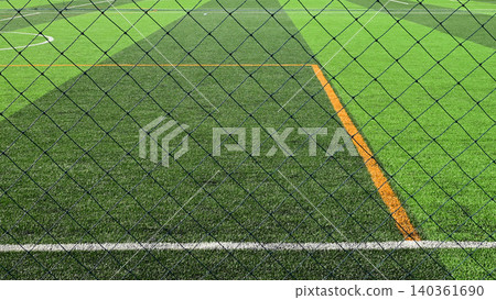 artificial green grass background with black net artificial green grass background with black net 140361690