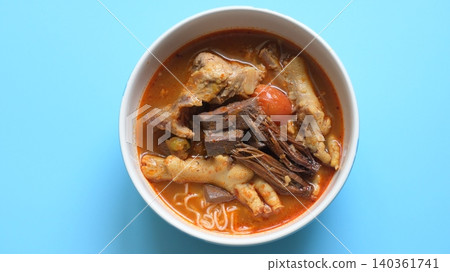 rice vermicelli with northern thai curry sauce on blue background rice vermicelli with northern thai curry sauce on blue background 140361741