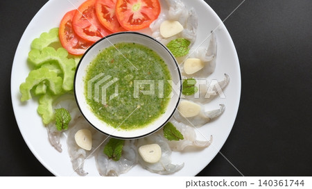 shrimp in fish sauce with Thai spicy seafood dipping sauce on white plate 140361744