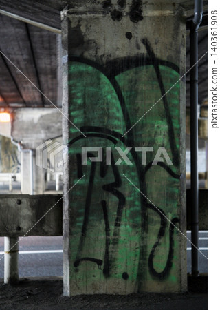 Graffiti-covered elevated bridge piers Graffiti-covered elevated bridge piers 140361908