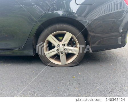 Image of a car trouble with a flat tire, with space for copying. Image of a car trouble with a flat tire, with space for copying. 140362424