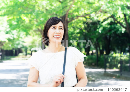 middle-aged women commuting to work middle-aged women commuting to work 140362447