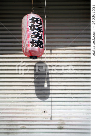 Lanterns and shutters on a store holiday Lanterns and shutters on a store holiday 140362552