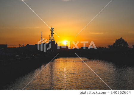 April 25 2026 Urban Communication Towers Silhouette Against Golden Sunset 140362664
