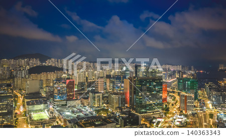May 22 2026 HONG KONG, CHINA. Kowloon Bay skyline glowing at night May 22 2026 HONG KONG, CHINA. Kowloon Bay skyline glowing at night 140363343