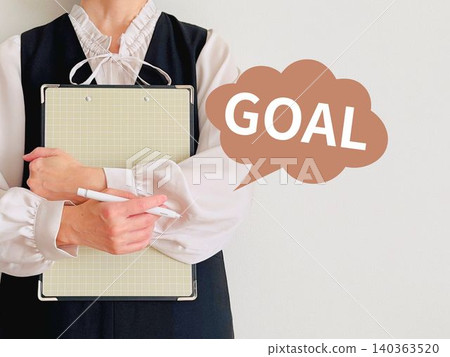 A woman holding a file and the word GOAL A woman holding a file and the word GOAL 140363520