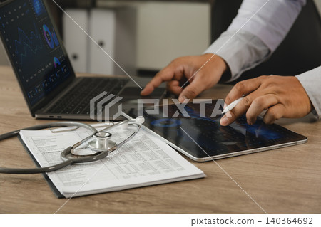 Healthcare business intelligence dashboard analysis on laptop and tablet with medical records. Data visualization, KPI monitoring, healthcare analytics, performance reporting, digital transformation 140364692