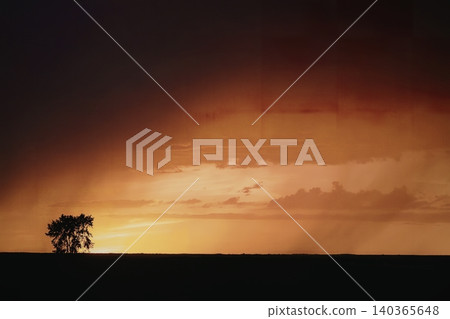 Beautiful orange and red sunset sky with dark clouds over horizon Beautiful orange and red sunset sky with dark clouds over horizon 140365648