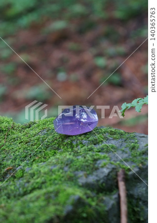 Amethyst on moss 140365763