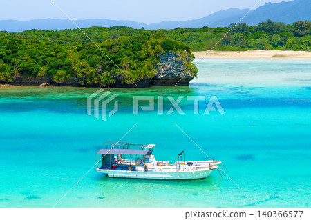 A boat floating in Kabira Bay A boat floating in Kabira Bay 140366577