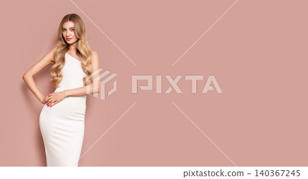 Blonde young woman in elegant white dress Blonde young woman in elegant white dress 140367245