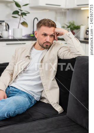 Young man after tough day shows tired mood silent stare and long sigh after many issues and stress 140367755