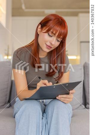 Young woman draws on paper makes sketch logo or illustration for work creative design process step Young woman draws on paper makes sketch logo or illustration for work creative design process step 140367832