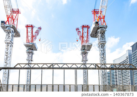 Large cranes and heavy machinery at construction sites Large cranes and heavy machinery at construction sites 140367873