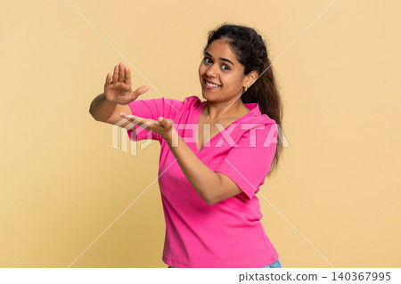 Indian woman joyfully throwing imaginary money in air, celebrating financial success with happiness Indian woman joyfully throwing imaginary money in air, celebrating financial success with happiness 140367995