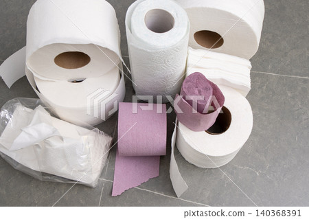 Rolls Of Toilet Paper Towels Hygiene. Roll on gray background top view Rolls Of Toilet Paper Towels Hygiene. Roll on gray background top view 140368391