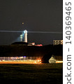 Lighthouse light at night 140369465