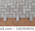 Gray Paver Bricks Laid in Herringbone Pattern 140369656