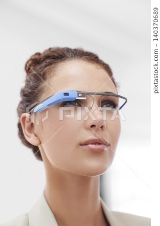Virtual reality, connection and businesswoman with smart glasses for internet network in office. Future technology, workplace and consultant with designer VR eyewear, vision and online communication. Virtual reality, connection and businesswoman with smart glasses for internet network in office. Future technology, workplace and consultant with designer VR eyewear, vision and online communication. 140370689
