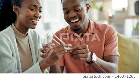 Happy, couple and learning at house with chopsticks, technique and assistance for new skill. Black people, laugh and help with sticks for dining etiquette, Japanese customs and bonding for tradition 140371265