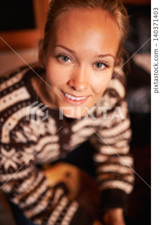 Closeup, portrait and woman in house for night, enjoyment and relax on weekend with smile. Home, winter and face of female person with resting on holiday, vacation or getaway from high angle 140371403