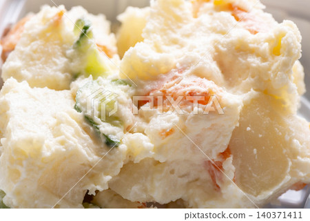 Potato salad is a classic Japanese dish made with potatoes, carrots, cucumbers, and mayonnaise. Potato salad is a classic Japanese dish made with potatoes, carrots, cucumbers, and mayonnaise. 140371411