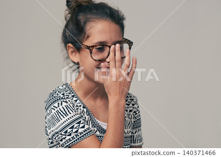 Children, vision and glasses with happy little girl in studio isolated on gray background for optometry. Youth, frame and eyewear with young female kid at eye clinic for prescription eyesight test Children, vision and glasses with happy little girl in studio isolated on gray background for optometry. Youth, frame and eyewear with young female kid at eye clinic for prescription eyesight test 140371466