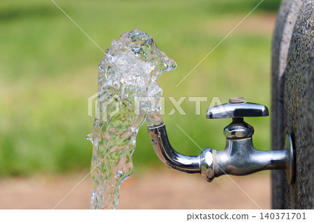 Water faucet in the park 140371701