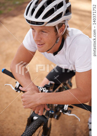 Face, smile and thinking with man cycling on dirt track for off road sports, exercise or fitness from above. Bike, nature and hobby with happy young athlete or cyclist outdoor in forest for cardio Face, smile and thinking with man cycling on dirt track for off road sports, exercise or fitness from above. Bike, nature and hobby with happy young athlete or cyclist outdoor in forest for cardio 140371752