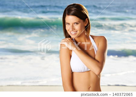 Woman, portrait and smile on beach in summer for travel, holiday or vacation in Maldives with relax and waves. Person, tourist and face with bikini or happy outdoor in nature for adventure or getaway Woman, portrait and smile on beach in summer for travel, holiday or vacation in Maldives with relax and waves. Person, tourist and face with bikini or happy outdoor in nature for adventure or getaway 140372065