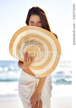 Woman, portrait and hat on beach in summer for travel, holiday and vacation in Maldives with relax and confidence. Person, tourist and face with beachwear outdoor in nature for adventure and getaway Woman, portrait and hat on beach in summer for travel, holiday and vacation in Maldives with relax and confidence. Person, tourist and face with beachwear outdoor in nature for adventure and getaway 140372085