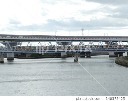 Train crossing an iron bridge Train crossing an iron bridge 140372425