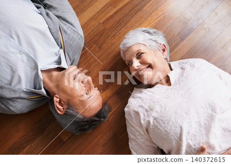 Smile, senior or happy couple on floor to relax in home living room for bonding or support in retirement. Above, old people or man lying down by an elderly woman for trust, peace or care in marriage Smile, senior or happy couple on floor to relax in home living room for bonding or support in retirement. Above, old people or man lying down by an elderly woman for trust, peace or care in marriage 140372615