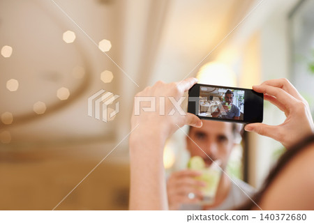 Restaurant, picture and couple with cellphone, screen and connection with mobile user and photograph. Date, man and woman with smartphone and digital app for memory and romantic with Valentines day 140372680