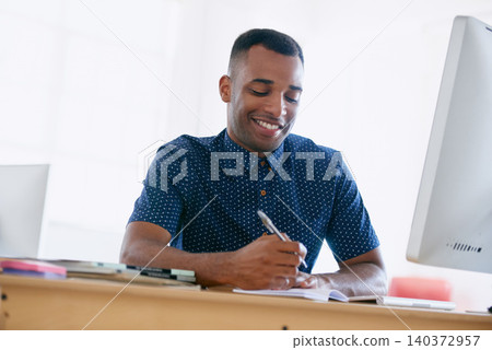 Computer, research and man writing notes in office for creative project on internet by desk. Technology, smile and professional male designer working online with desktop in modern workplace. Computer, research and man writing notes in office for creative project on internet by desk. Technology, smile and professional male designer working online with desktop in modern workplace. 140372957