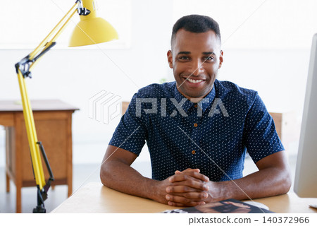 Young businessman, portrait and confident in office by desk, consultant and creative in fashion. Happy, black man or positive face of designer in co working space or about us for ambition in company 140372966